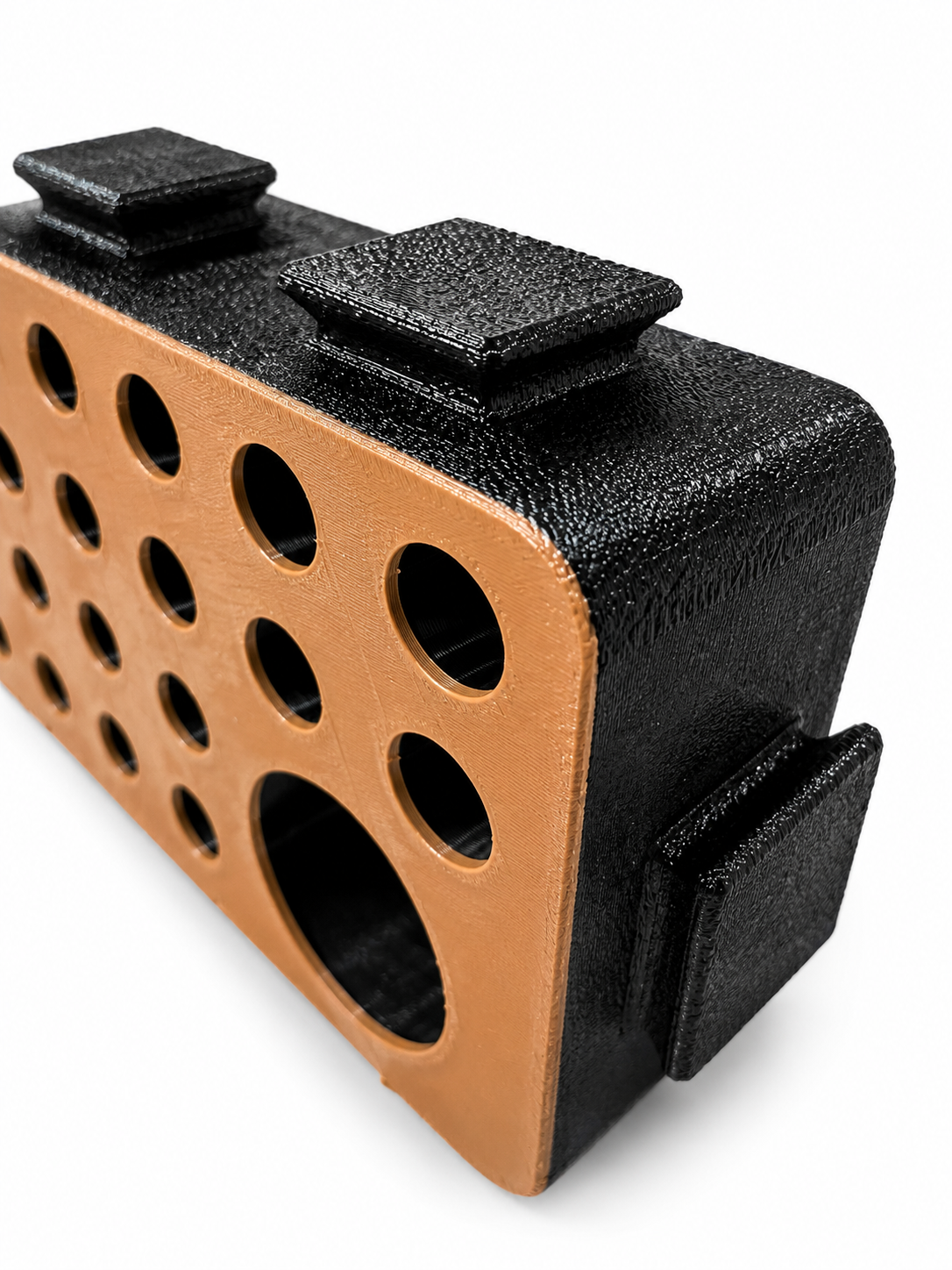 Close-up of a D-Block face with varied hole sizes for hide placement